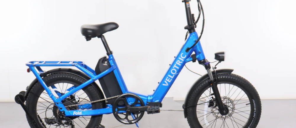 A blue Velotric Fold 1 electric folding bike
