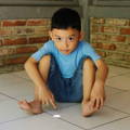 male-child-sitting-on-ground