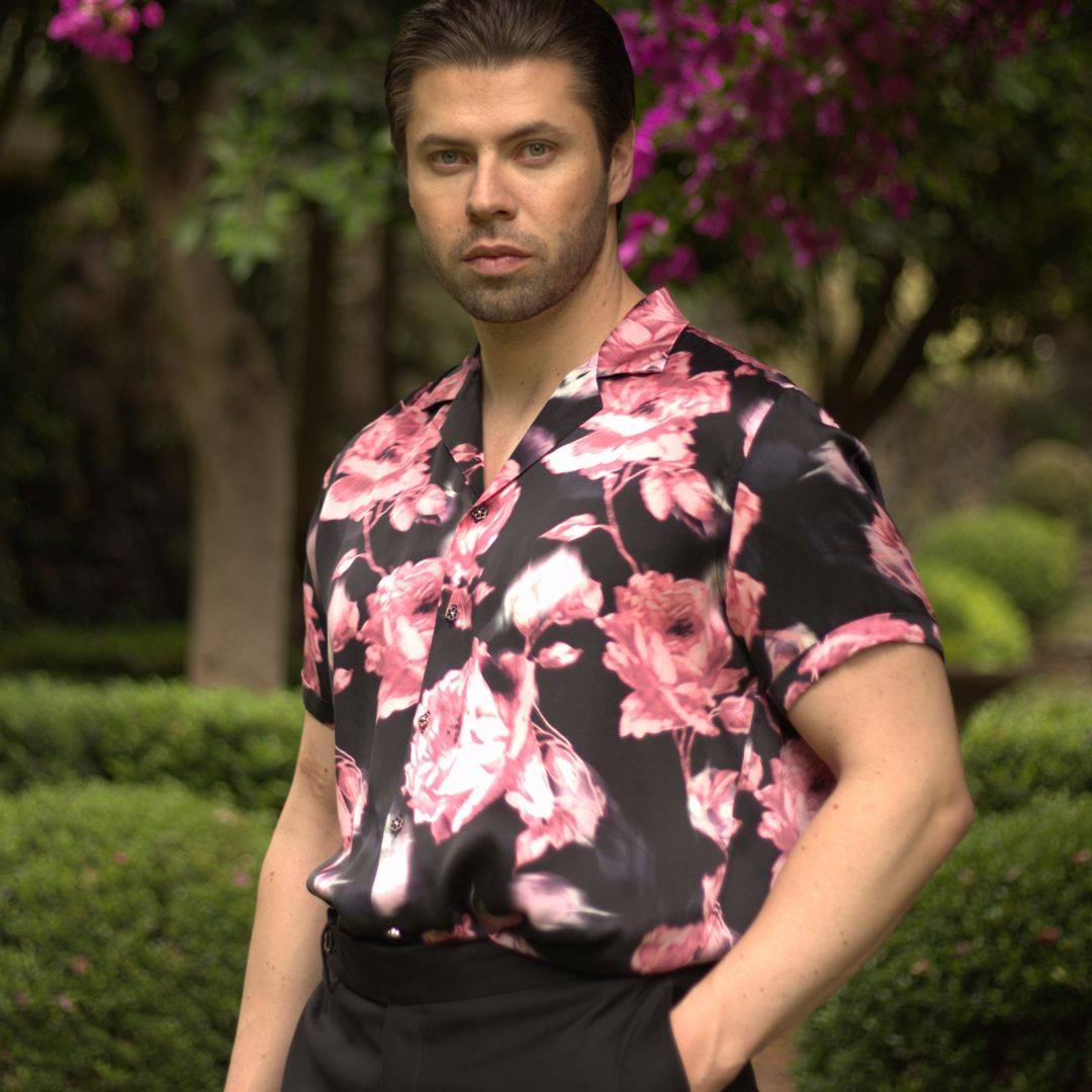 model wearing black pants and a black floral short sleeve silk shirt from 1000 kingdoms