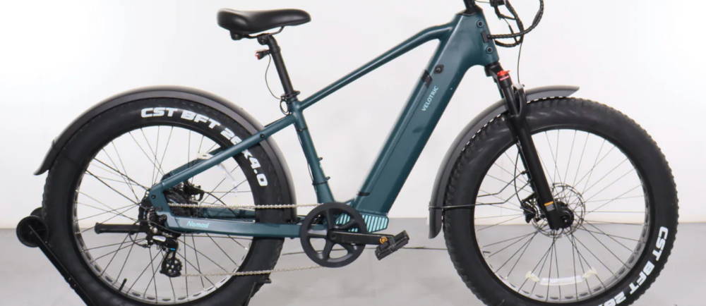 a dark blue Velotric Nomad 1 electric fat tire bike