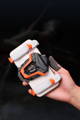 BIGBIG WON Freeze Gaming Cooler ventilador cooling fan and other accessories installed on a mobile smartphone held in a hand