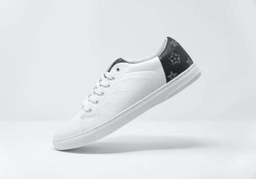 A white sneaker on light grey background