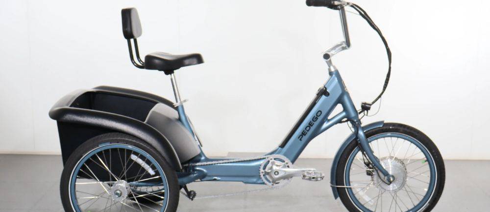 Pedego Fat Tire Trike on a stand