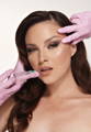 Beautiful woman with syringe aimed at her face