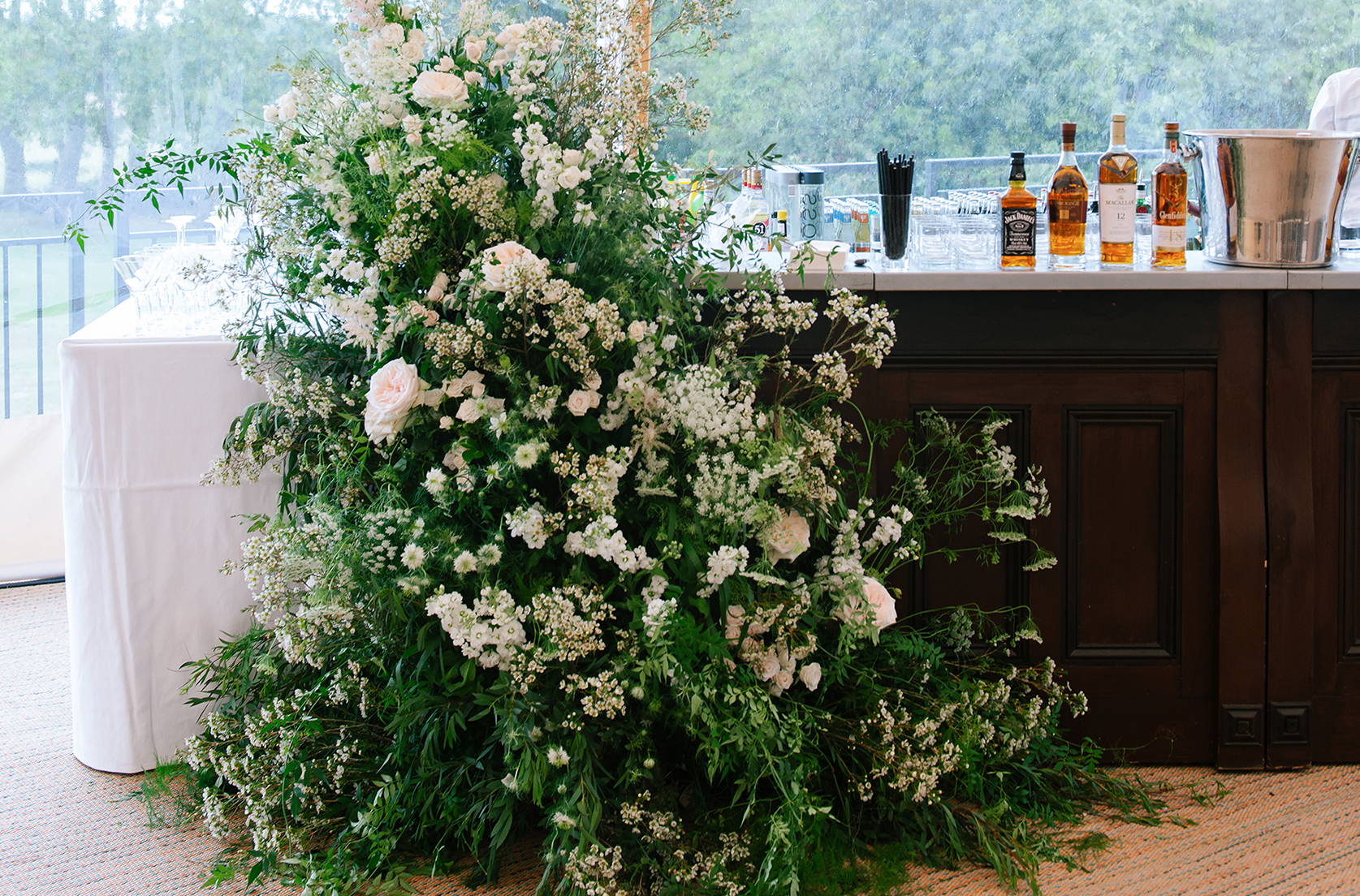 Wild at Heart floral asymmetric bar dressing for a wedding at Wrotham Park