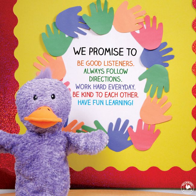 Primrose puppet Billy the duck stands next to the promise board