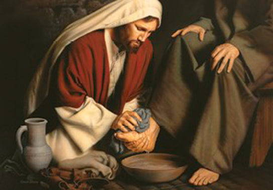Jesus washing disciple's feet.