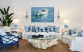 Main Image is of a white slipcovered Majorca Sofa with Art.