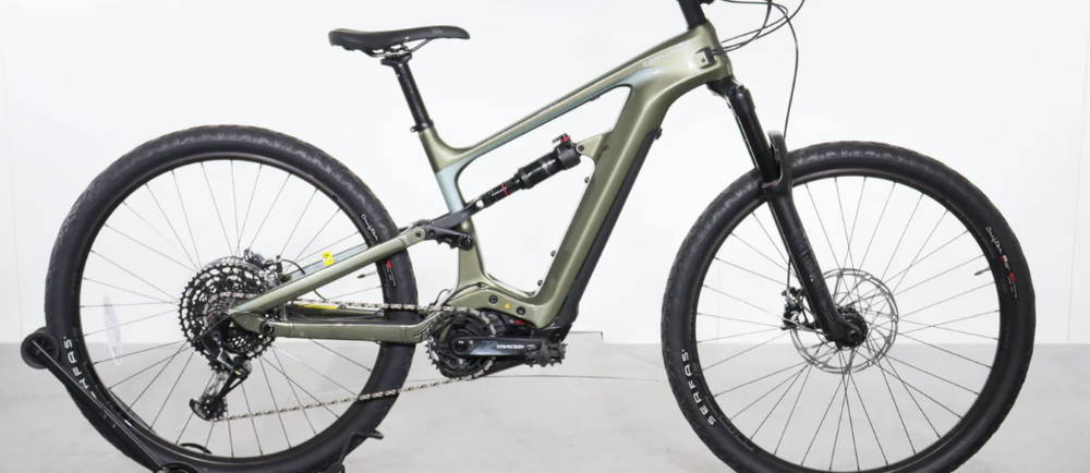 a lime green Cannondale Habit Neo 2 full suspension electric mountain bike