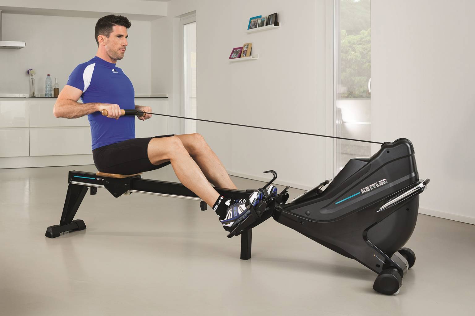 Doing Exercises on Rowing Machine at Home