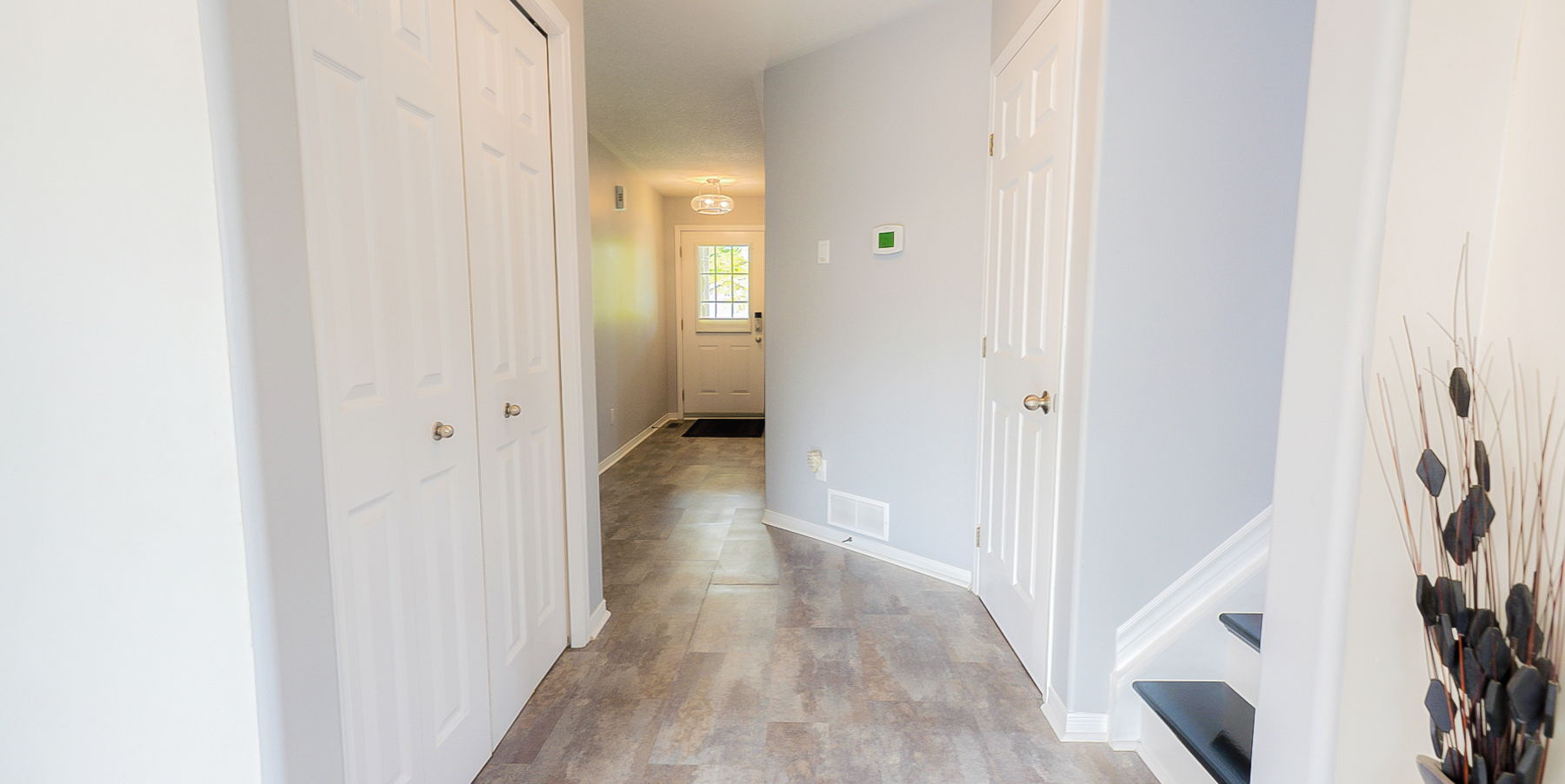 corridor featuring hardwood floors and natural light