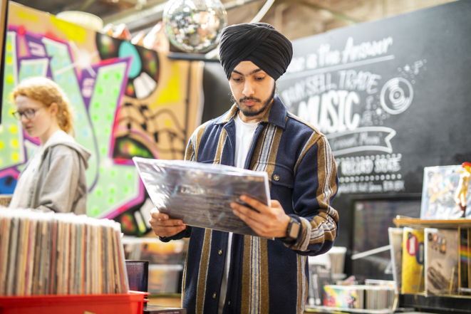 Student buying records at a music shop