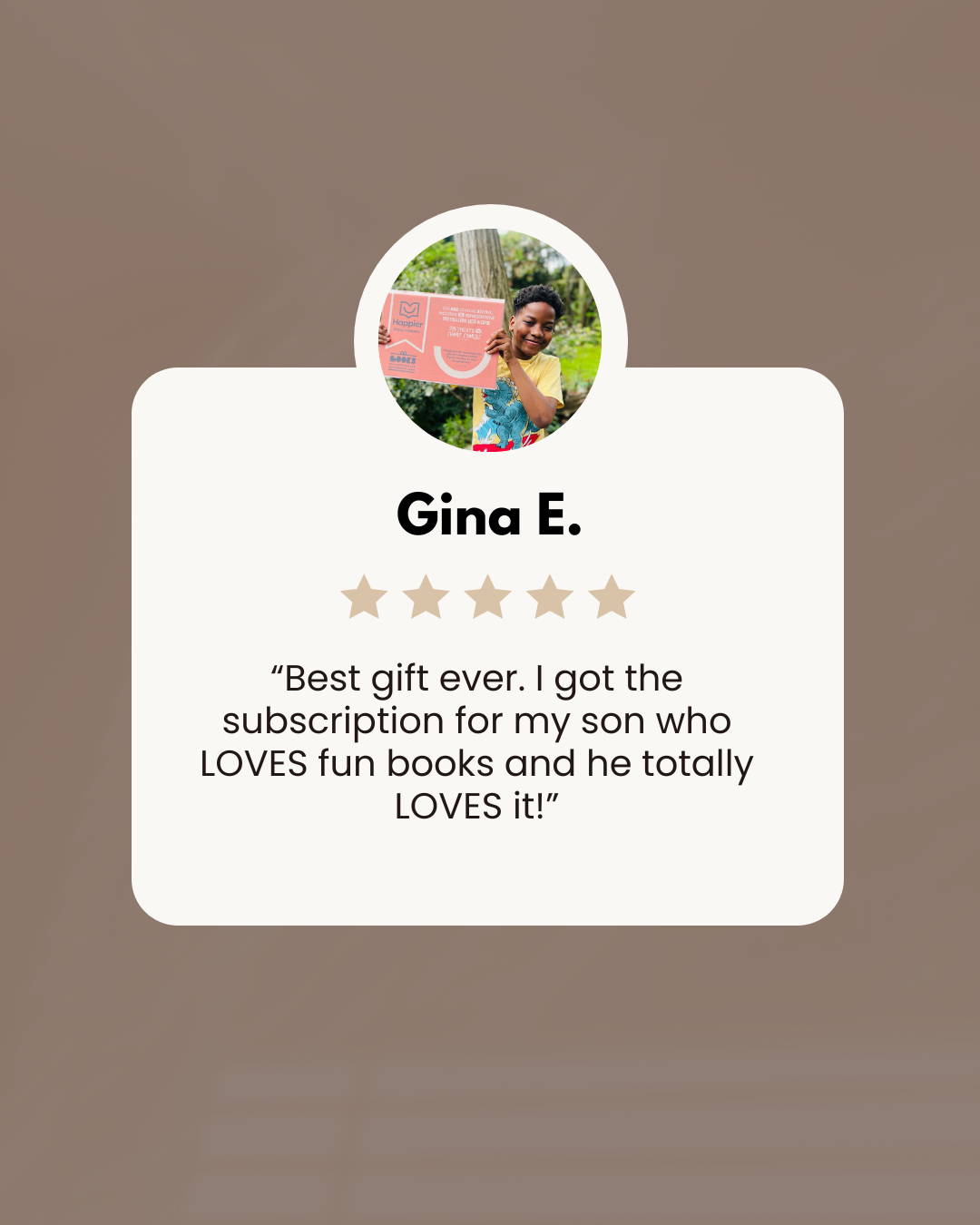 Boy holding up subscription box with a review for Happier Every Chapter Thought Leaders book box
