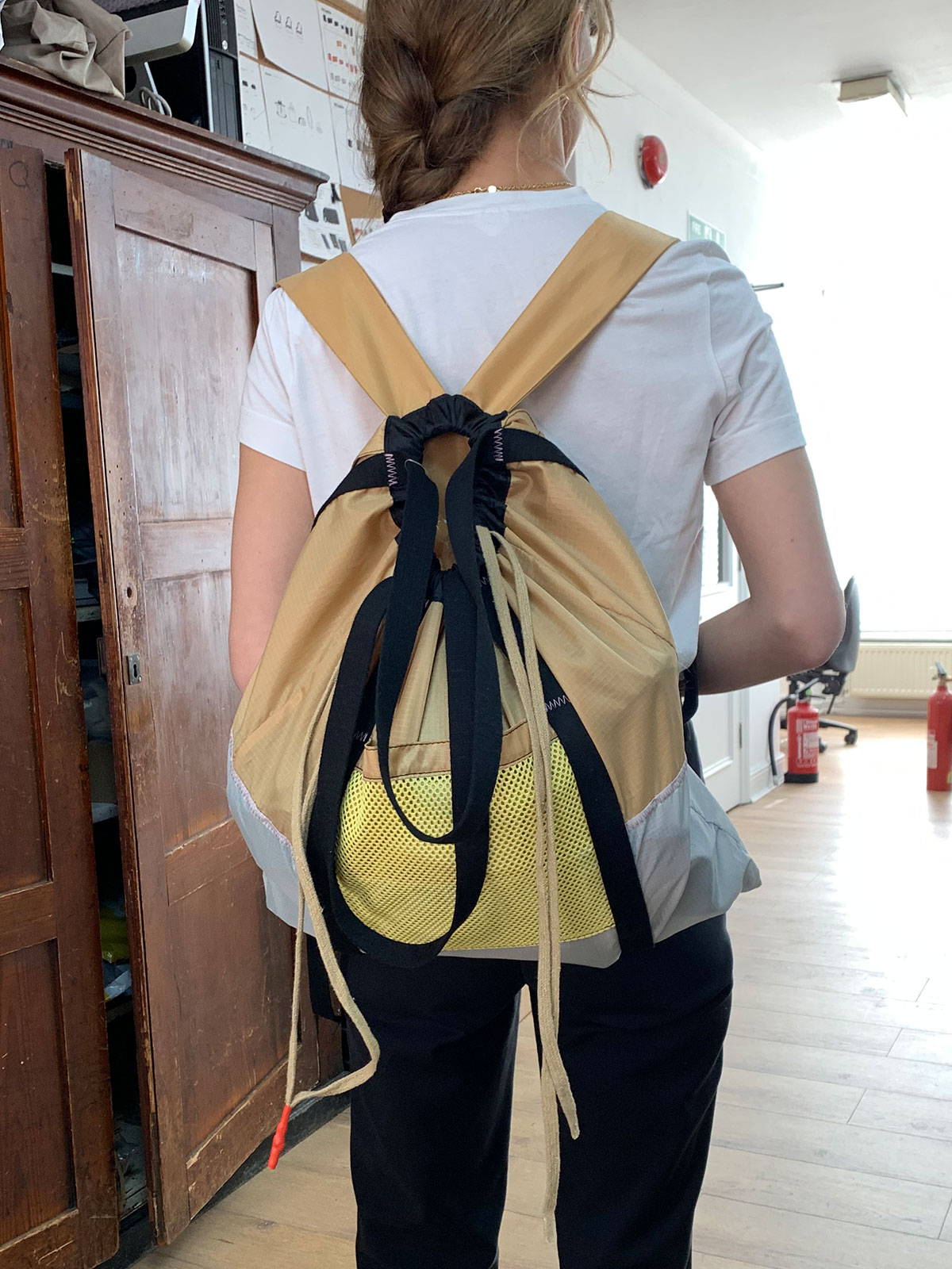 Model wearing Harvey packable backpack