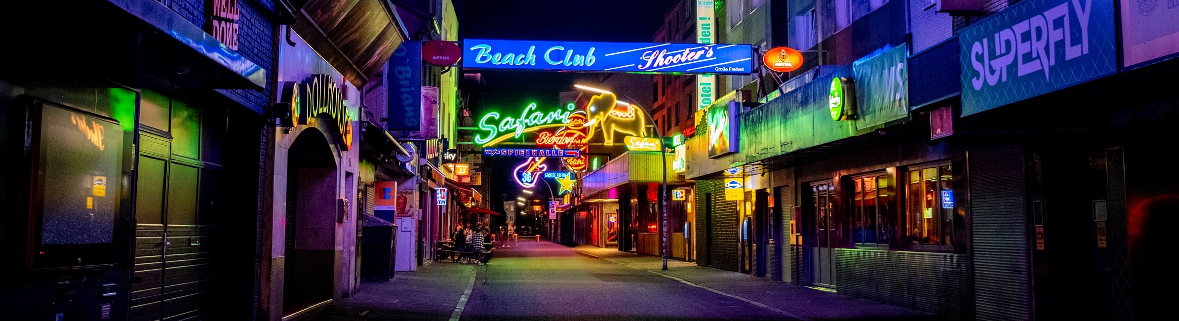 Neon signs over street