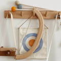 Montessori Wooden Bow and Arrow Set hanging from a coat hanger. 