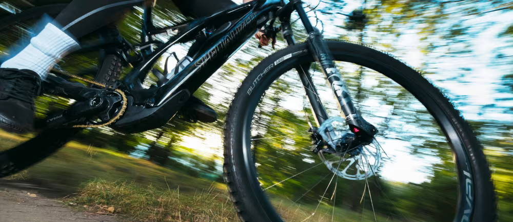 Specialized E-MTB riding past the camera fast