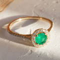 emerald engagement ring with diamonds yellow gold
