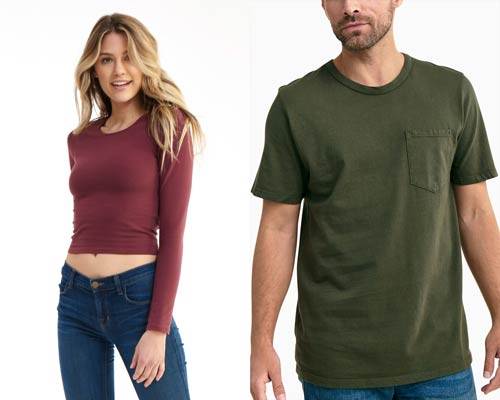 Woman wearing Groceries Apparel organic cotton long sleeve burgundy crew neck cropped top and man wearing olive green relaxed fit short sleeve t-shirt