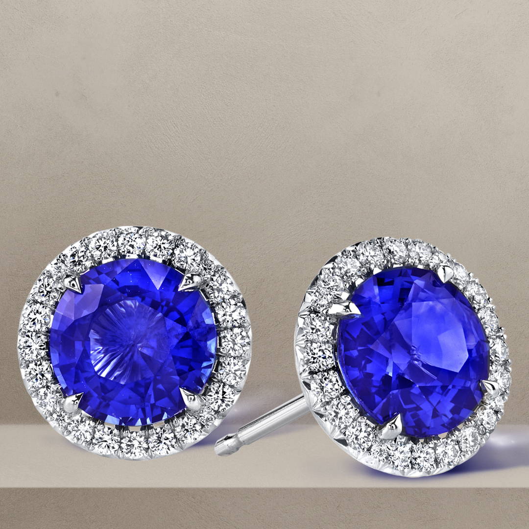 Sapphire stud earrings with diamond halo.