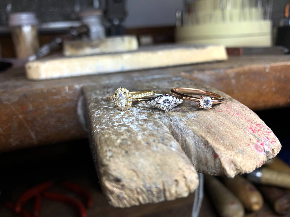 Three jewels on the ankle of a jeweller's bench