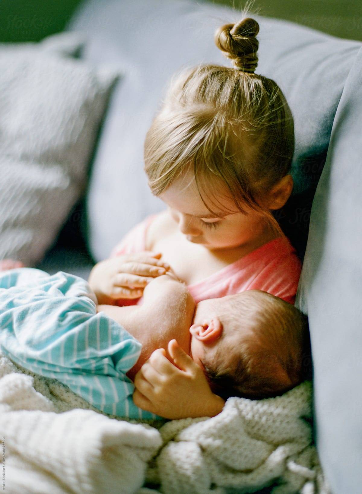 Getting Started with Stock Photography: Child Holding a Baby