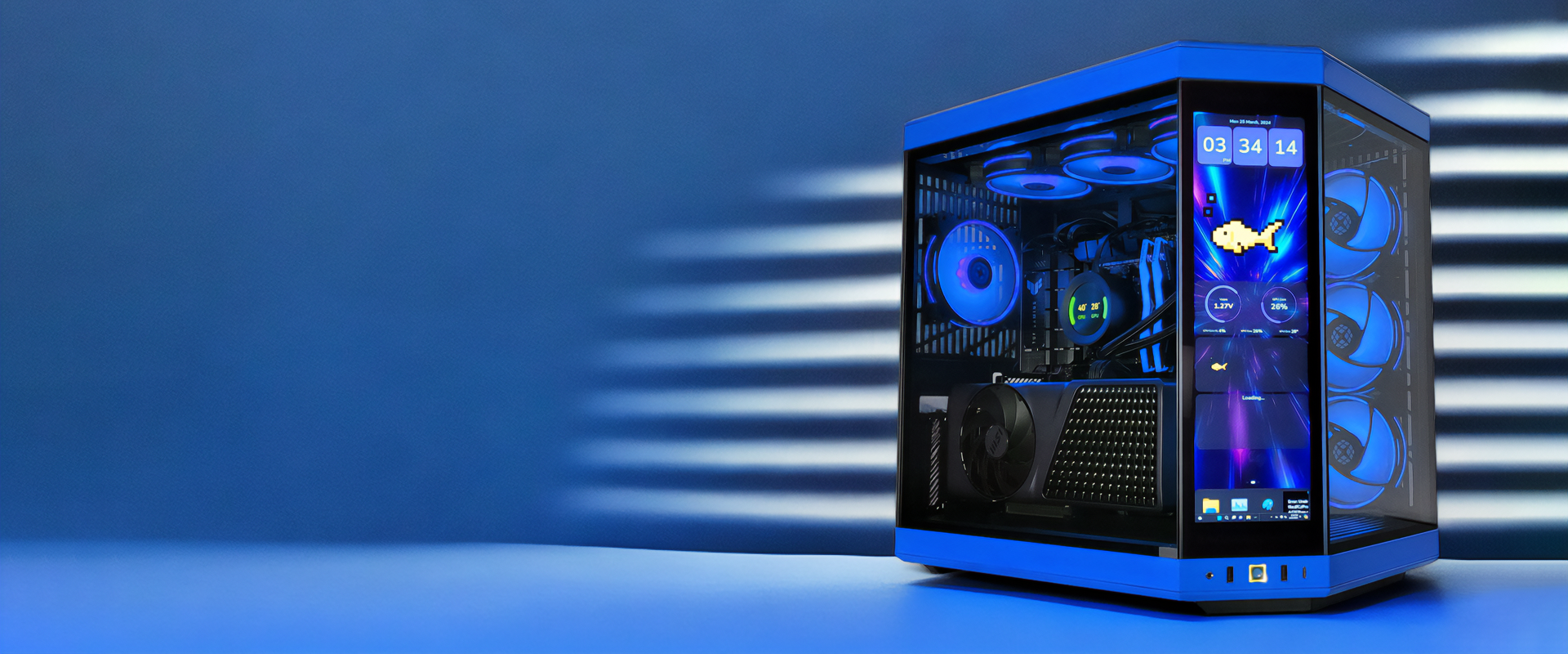 The image showcases a high-end gaming PC with a transparent case illuminated by blue LED lights. The interior components are clearly visible, including multiple fans, a large graphics card, and a CPU cooler. The front panel features an integrated display showing system metrics, time, and an animated fish. The background is a gradient of blue tones, giving the entire setup a futuristic and sleek appearance.