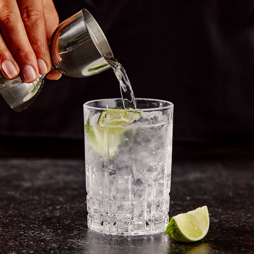 Puring Vodka into a simply devlish cocktail
