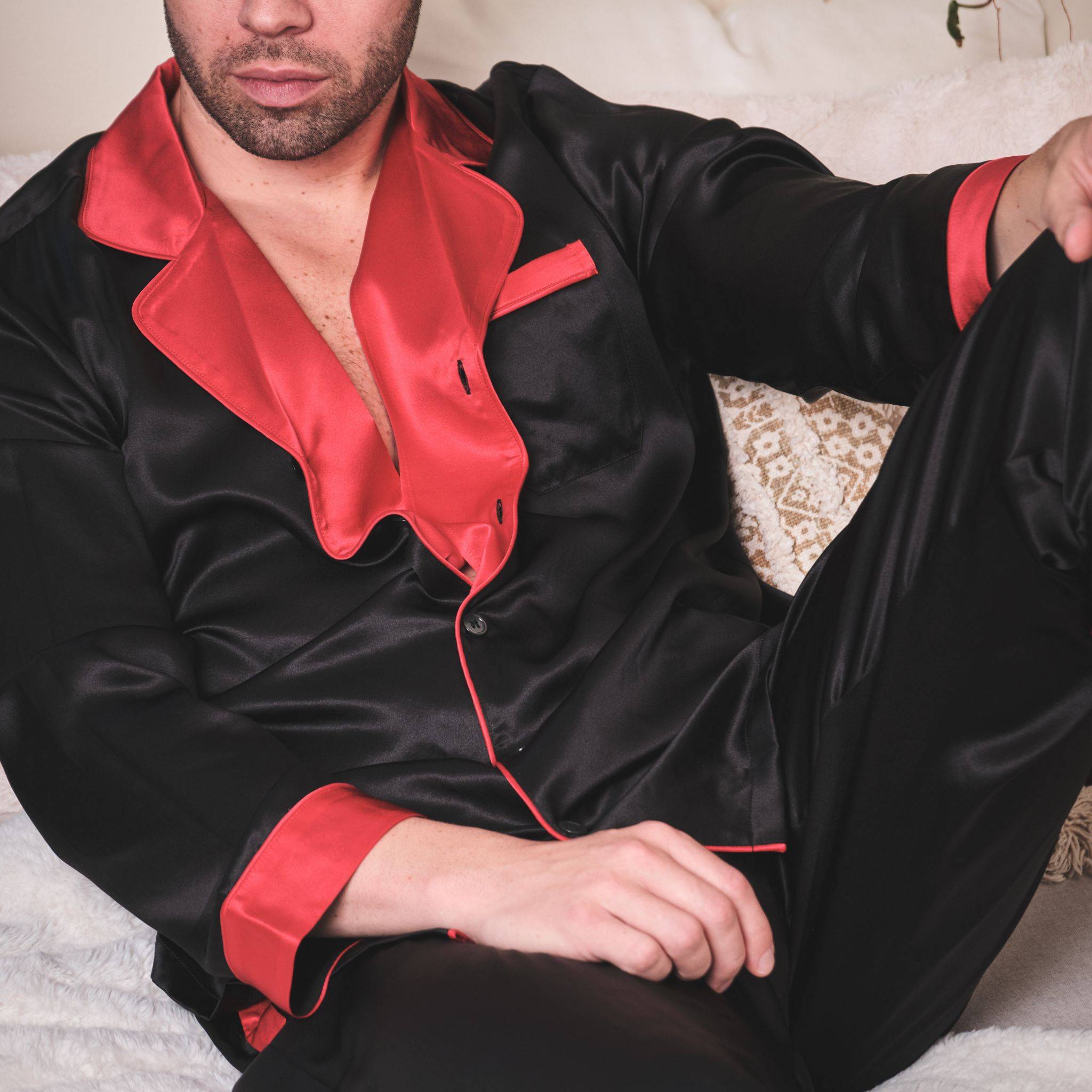 model wearing black and red silk pajamas from 1000 kingdoms