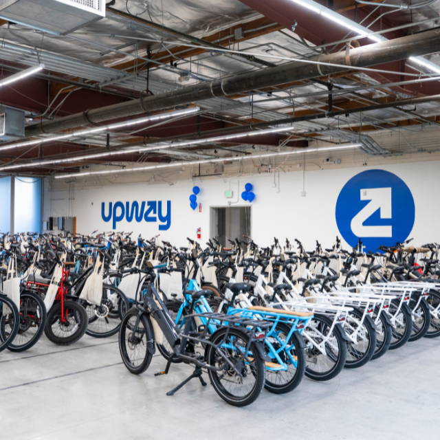 the Upway warehouse with rows of bikes