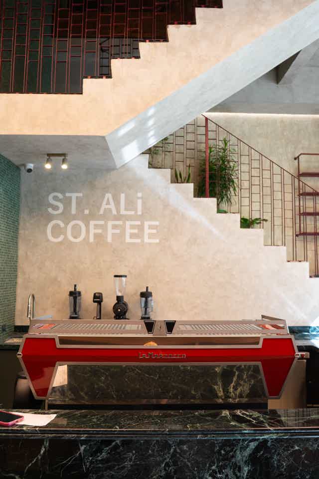 Female barista pouring coffee milk