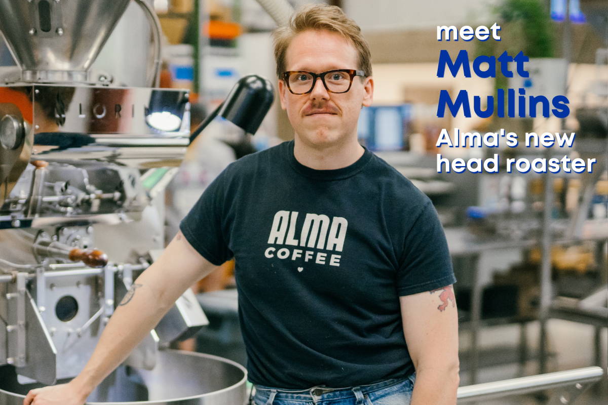 Man standing in front of a coffee roaster
