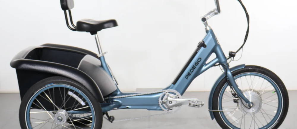 A light blue Pedego Trike electric tricyle