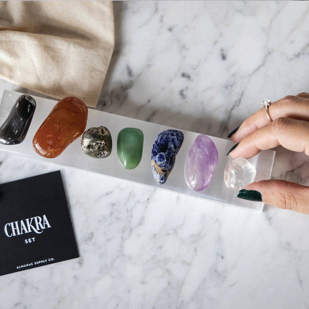 Healing Crystals for the seven chakras on a Selenite charging bar