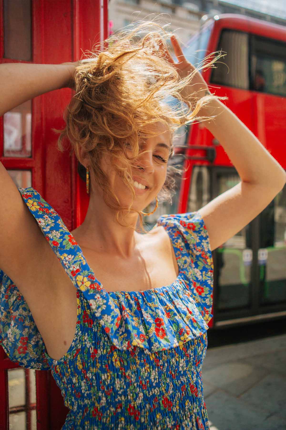 Honey Simmonds wears Yolke's off the shoulder blue floral smock bardot midi dress