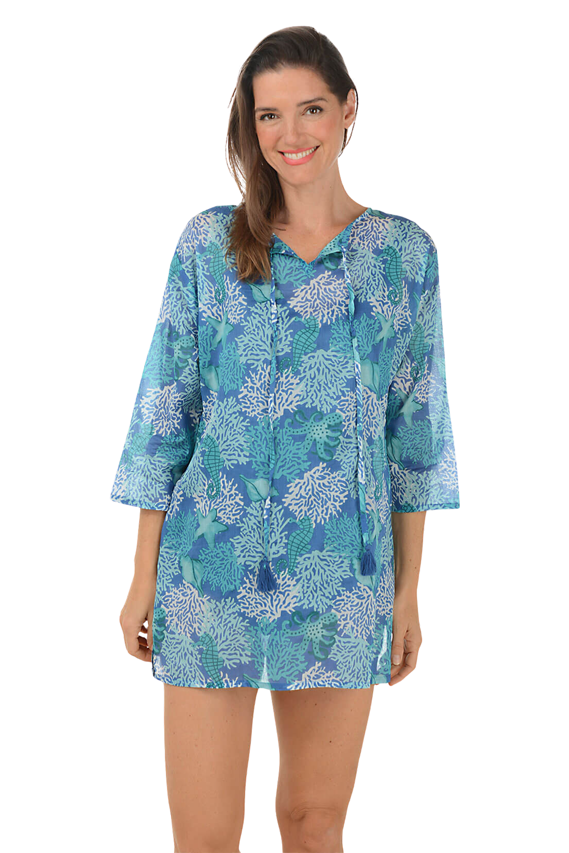 A woman wears a cotton gauze tunic cover-up.