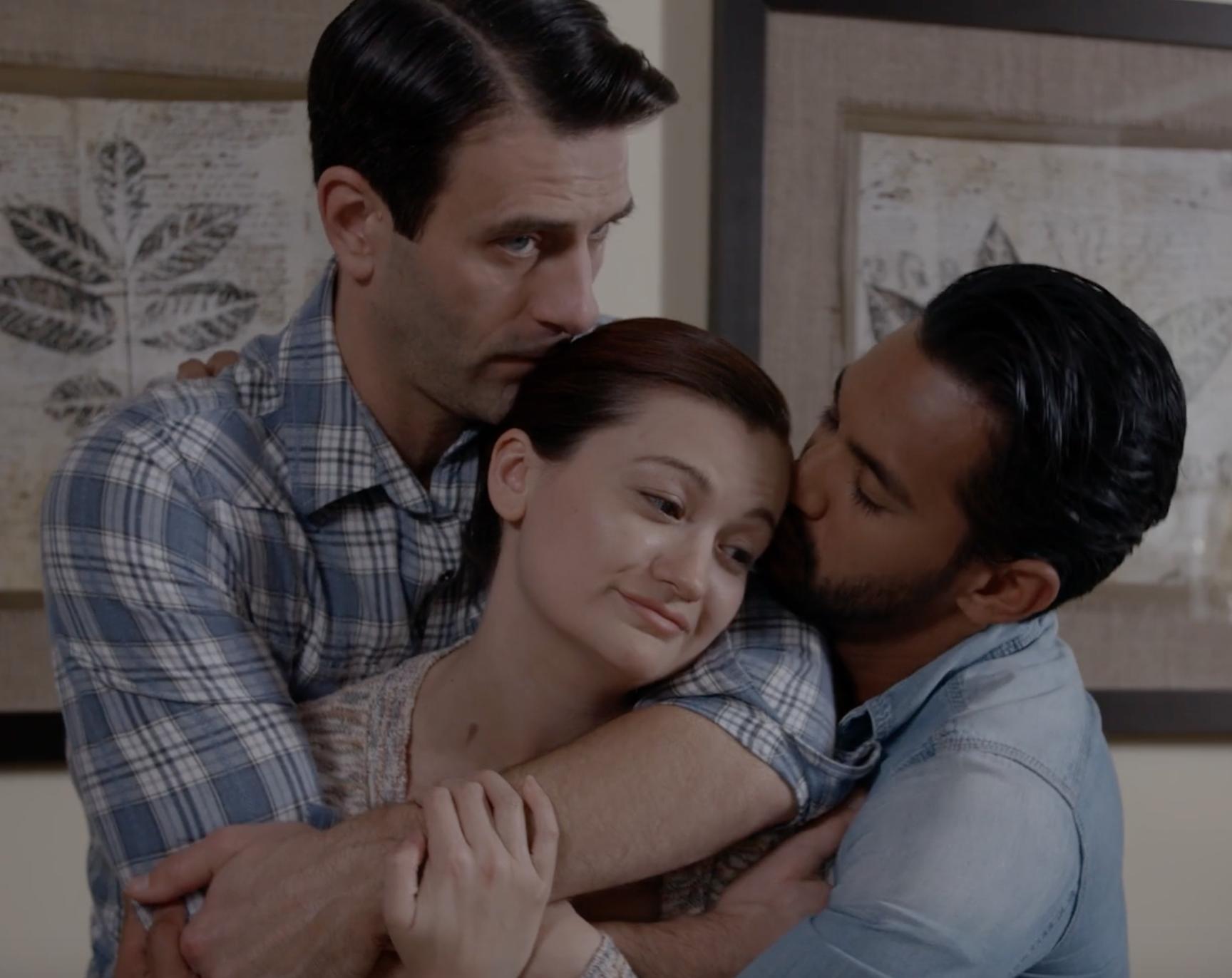 Beau and Caden hold Lily in an embrace inside the living room.