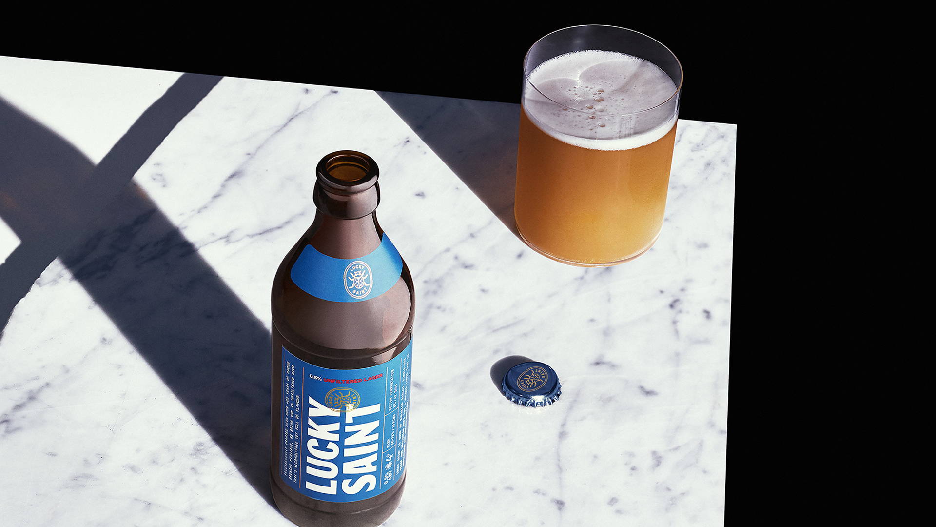 Featured image for Non-Alcoholic Beer Gets a Modern Type-Heavy Look With Lucky Saint