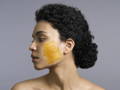 woman with an exfoliating face mask applied