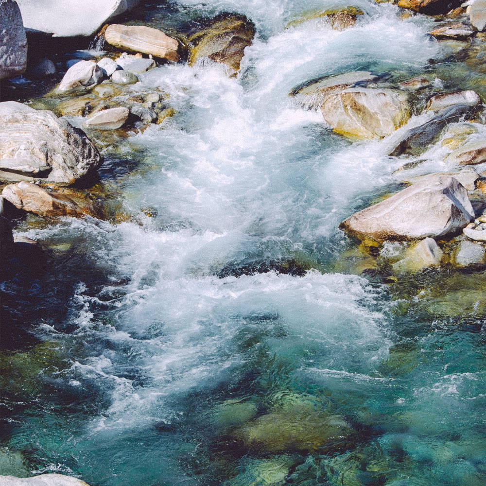 Pure spring water flowing down a river