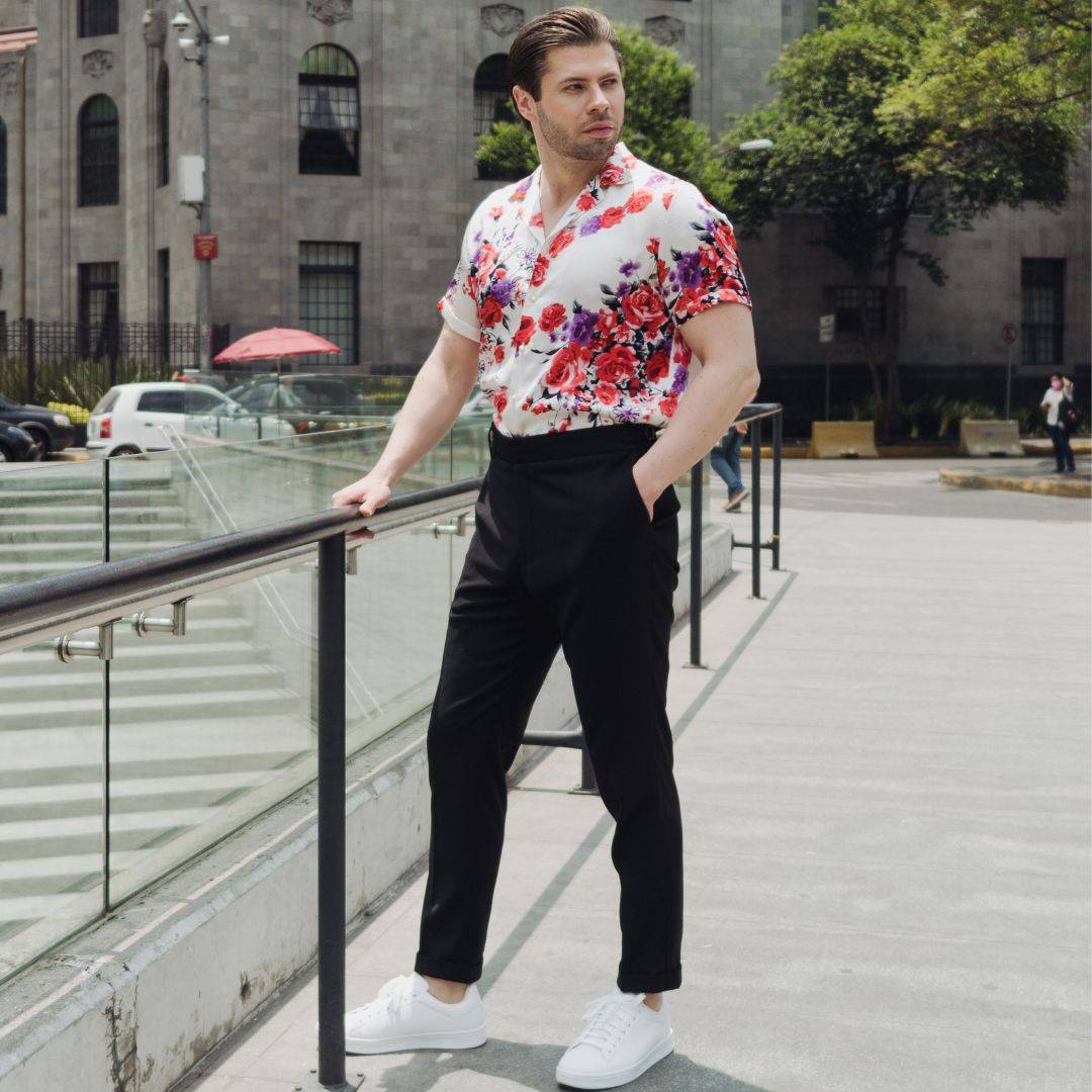 model wearing white shoes black pants and a short sleeve white floral silk shirt from 1000 kingdoms