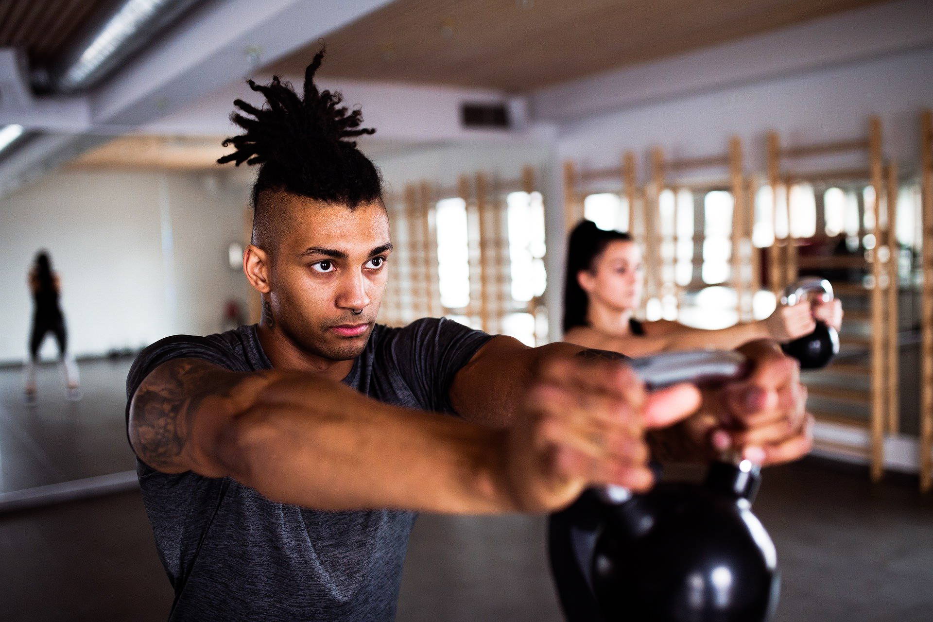 Young man exercising with kettlebell