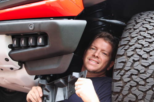 mike owner of m&R automotive installing fog light kit with eight 20watt light pods on ford bronco raptor