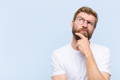 a man with his hand on his chin, wondering about the differences between bovine and marine collagen