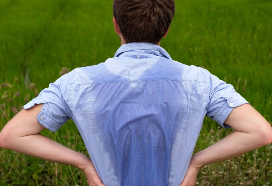 Man experiences excessive sweating through his shirt