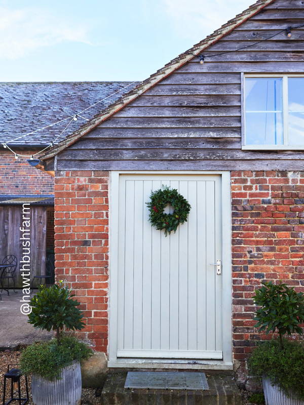 Hawthbush Farm with a wreath on the door