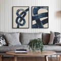 set of two abstract art prints above a sofa. Blue living room art prints above sofa