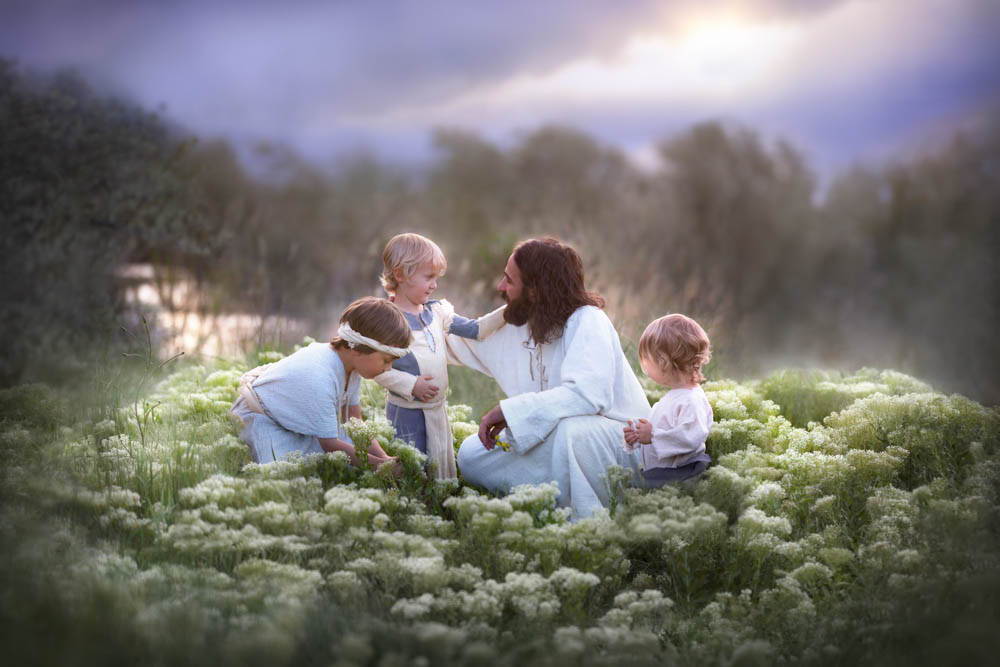 Jesus sitting a patch of flowers with children.