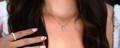 Petite Diamond Cross Necklace on Woman