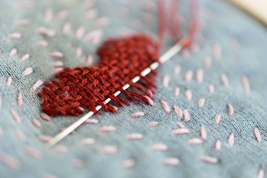 visible mending with a woven heart weft